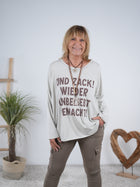 langarm Shirt mit Statement Motiv und überschnittenem Arm